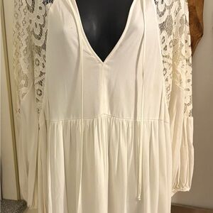 Pretty ivory Dress with Lace Sleeves and back.